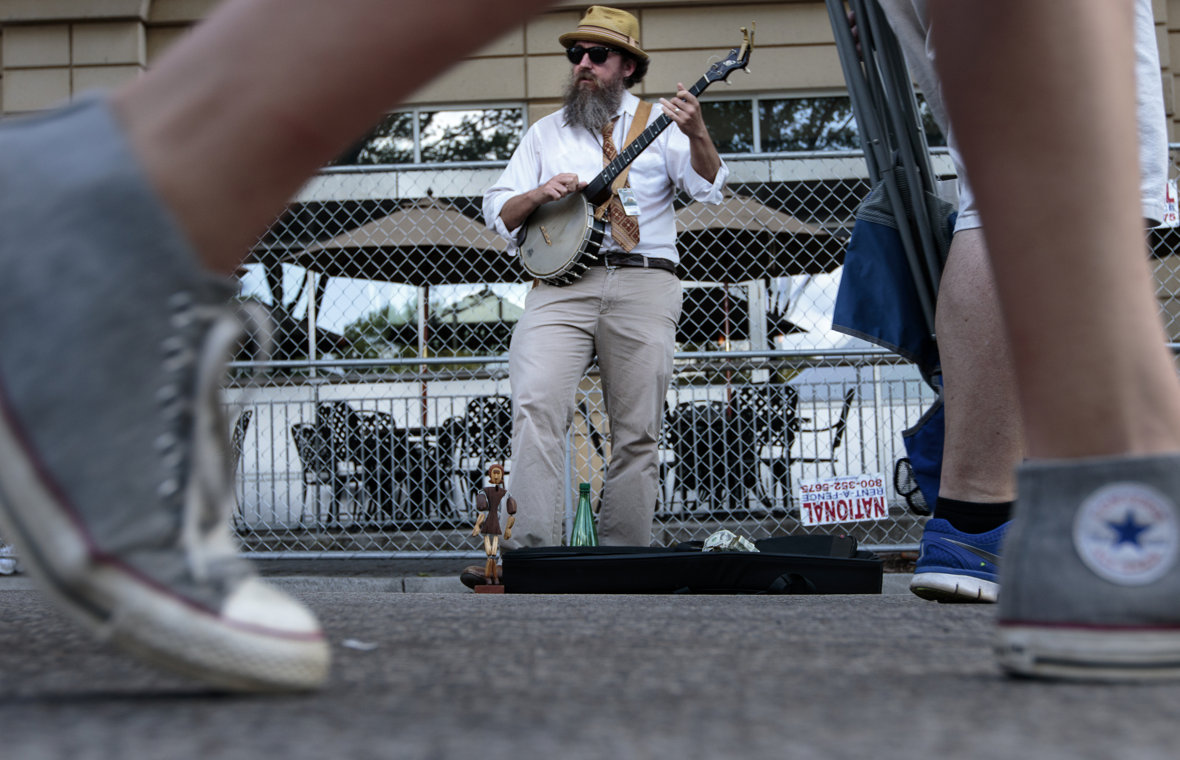 Staff photo by Doug Strickland
Matt Downer of the Old Time Travelers band plays banjo as people enter the final day of the Riverbend Festival on Saturday, June 13, 2015, in Chattanooga, Tenn. Headliner Stone Temple Pilots closed the festival.