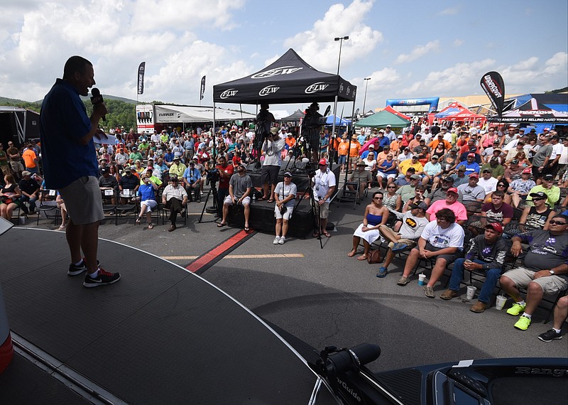 Staff Photo by Tim Barber/Chattanooga Times Free Press - June 13, 2015 
FLW Tour fishing weigh master Chris Jones gets the crowd charged up just before the 4 p.m. weigh-in at the Dayton(Tenn) Walmart parking lot Saturday afternoon.
