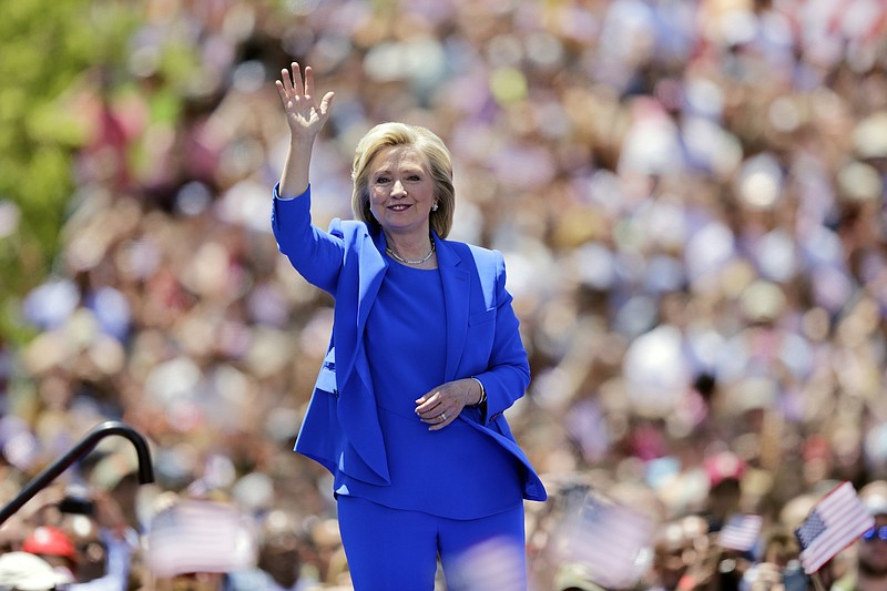 Democratic presidential candidate, former Secretary of State Hillary Rodham Clinton, waves to supporters Saturday, on Roosevelt Island in New York.