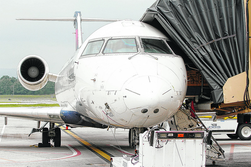 A Delta flight destined for Atlanta docks at the Chattanooga Airport.