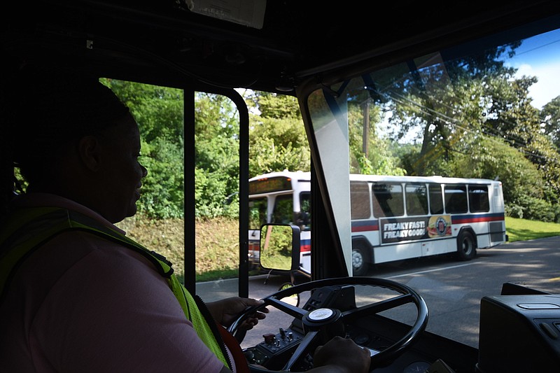 CARTA bus driver Natasha Maples passes a southbound  #16 in the S-curves on Hixson Pike enroute to Northgate Mall. Next week, CARTA will offer free rides all day in their annual Dump the Pump promotion.