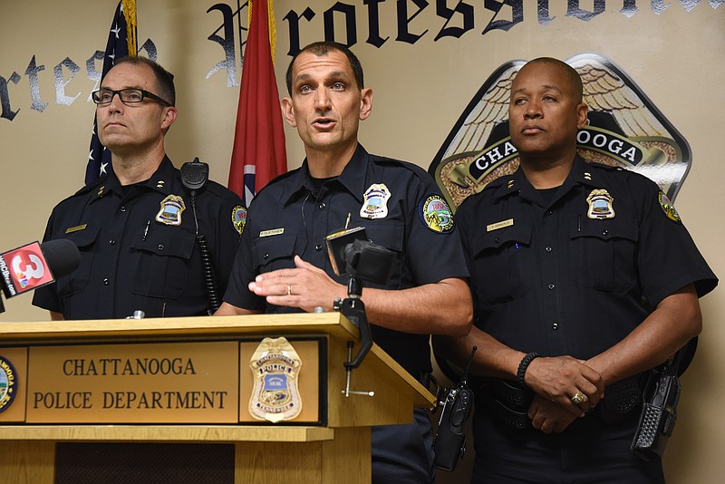 Chattanooga Police Chief Fred Fletcher talks about an ongoing feud between gangs that has resulted in several shootings, even threatening the lives of little children with the acts of violence. Assistant Chief Eric Tucker, left, and Assistant Chief Tracy Arnold, right, stand with Fletcher.