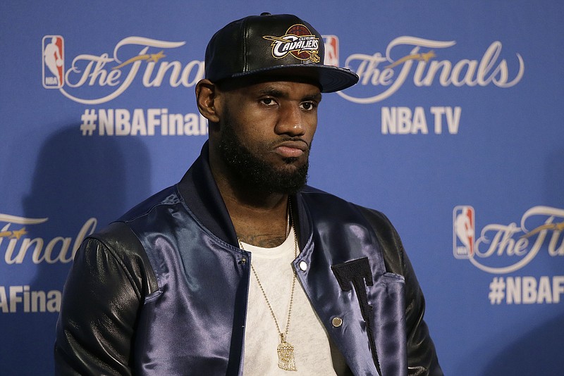 
              Cleveland Cavaliers forward LeBron James speaks at a news conference after Game 5 of basketball's NBA Finals against the Golden State Warriors in Oakland, Calif., Sunday, June 14, 2015. The Warriors won 104-91. (AP Photo/Ben Margot)
            