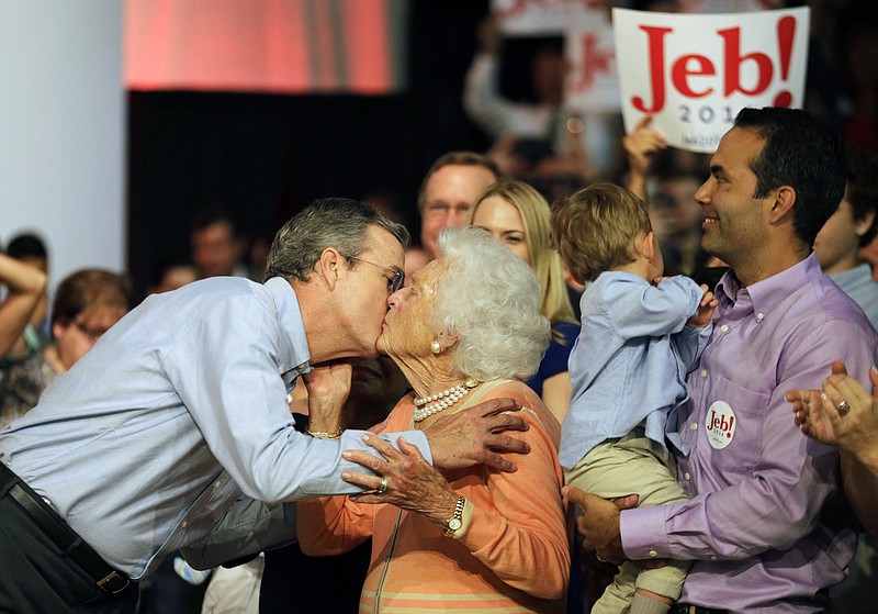 The Associated PressRepublican presidential candidate Jeb Bush, left, kisses his mother, former first lady Barbara Bush, as his son George, right, watches as the former Florida governor kicks off his campaign.