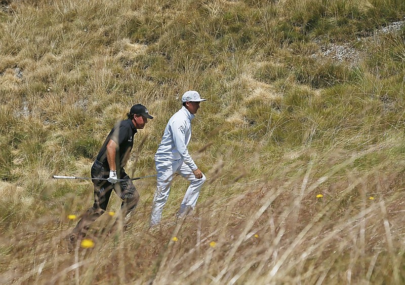 Phil Mickelson, left, and Rickie Fowler walk to the 13th hole during a practice round for the U.S. Open golf tournament at Chambers Bay on Tuesday, June 16, 2015 in University Place, Wash. (AP Photo/Matt York)