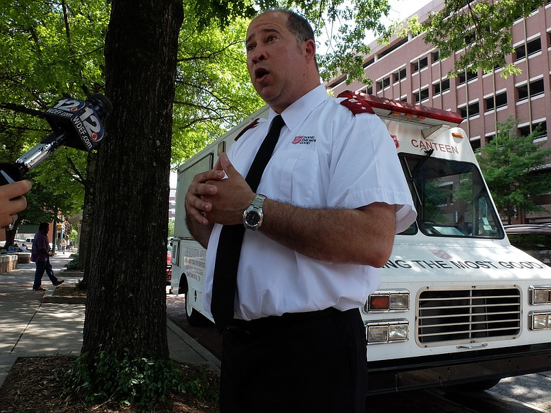 Salvation Army Captain Aaron Goldfarb talks about the beat the heat services they are providing Tuesday in Miller Park.
