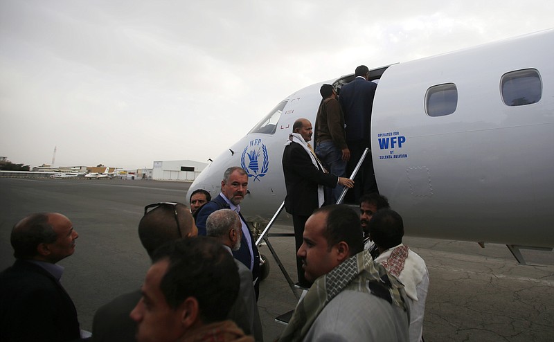 
              Yemeni political groups, including Shiite rebels known as Houthis, get on an airplane for Geneva for U.N.-led peace talks at the airport in Sanaa, Yemen, Sunday, June 14, 2015. The talks are slated to be first substantive meetings by all parties involved in the conflict. (AP Photo/Hani Mohammed)
            