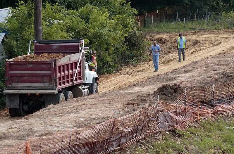 Staff photo by Doug Strickland
A dump truck is used to dump additional earth while improving the Brainerd Levee near Interstate 75 and Spring Creek Road on Tuesday, June 16, 2015, in Chattanooga, Tenn.