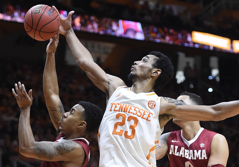 Associated Press file photoTennessee guard Derek Reese attempts to block a shot by Alabama guard Ricky Tarrant, left, as Alabama forward Michael Kessens looks on in Knoxville in this January photo. Tennessee lost 56-38.