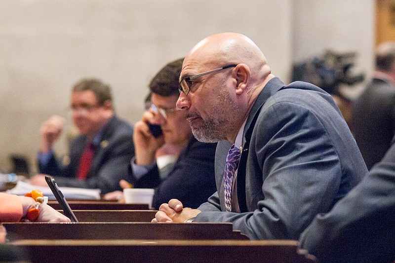 
              FILE - In this April 14, 2015, file photo, state Rep. Joe Armstrong, D-Knoxville, attends a House floor session at the state Capitol in Nashville, Tenn. Armstrong was indicted on Tuesday, June 16, 2015, on federal fraud and tax evasion charges. Armstrong's attorney said the lawmaker plans to plead not guilty. (AP Photo/Erik Schelzig, file)
            