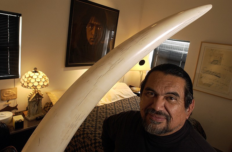 
              FILE - In this Feb. 2004 file photo, sculptor Jesus Moroles poses for a photo in his home in Rockport, Texas. Texas sculptor and National Medal of the Arts recipient Moroles died Monday, June 15, 2015, in a traffic accident in Jarrell, Texas, the Texas Department of Public Safety says. (AP Photo/Corpus Christi Caller-Times, Tim Zielenbach, File)
            