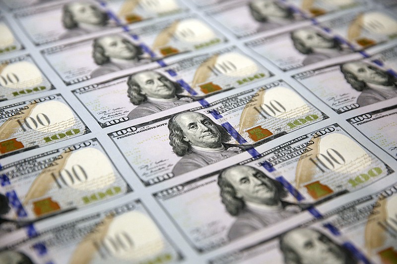 The Associated Press File PhotoUncut sheets of "Benjamins" — $100 bills — make their way through the printing process at the Bureau of Engraving and Printing Western Currency Facility in Fort Worth, Texas. The Congressional Budget Office warned last week that the long-term outlook for the federal budget has worsened dramatically.