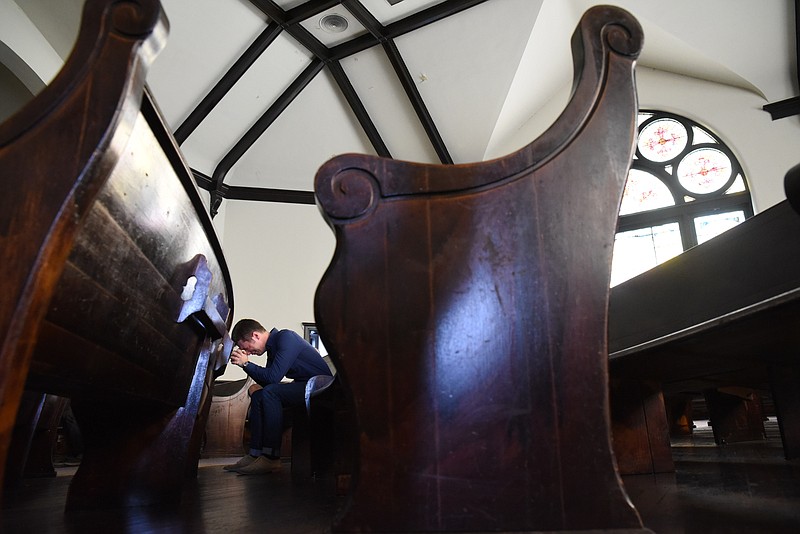 Staff Photo by Tim Barber/Chattanooga Times Free Press - June 18, 2015 
Robert Winslow prays in the sanctuary Thursday at Mercy Junction Justice and Peace Center at St. Andrews on Union Avenue. "I prayed for they that died, and that there not be more hate," Winslow said following the time of silence.