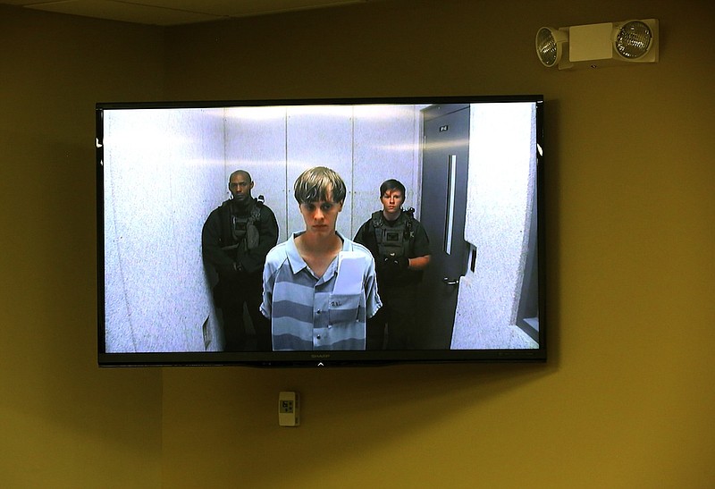 Dylann Roof appears at a bond hearing court in North Charleston, S.C. Roof is charged with nine counts of murder and firearms charges in the shooting deaths Wednesday at Emanuel African Methodist Episcopal Church