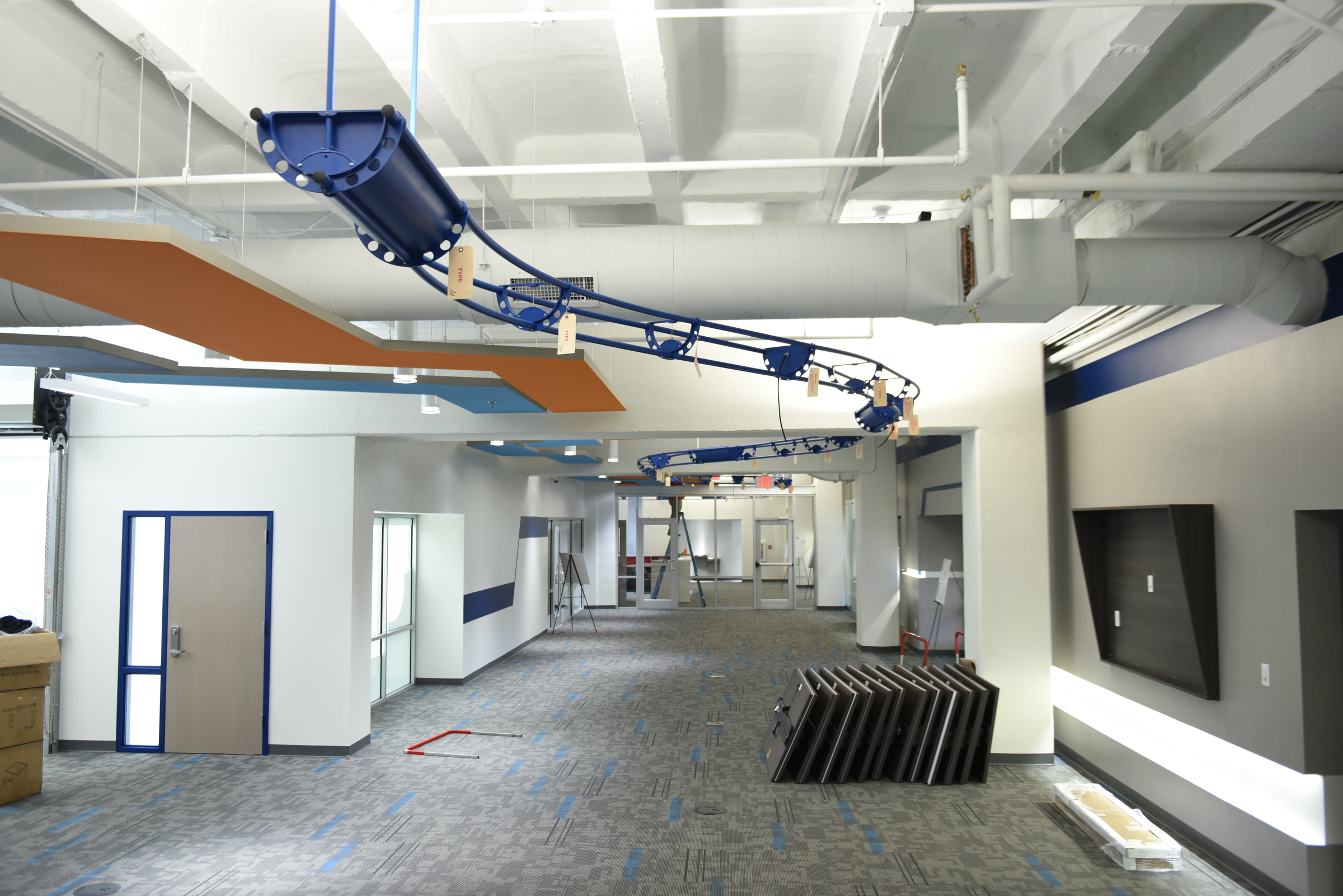 Staff photo by John RawlstonA blue metal frame hanging from the ceiling will be used to route wires at TechTown.