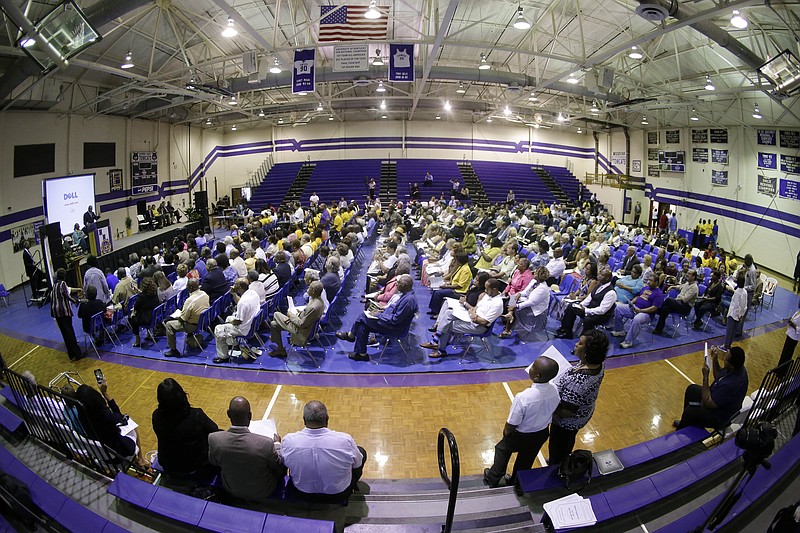 
              A service honoring Elbert Williams is held in the Haywood County High School gymnasium on Saturday, June 20, 2015, in Brownsville, Tenn. Williams was killed by unknown assailants on June 20, 1940, amid a drive to register black voters. Williams was taken from his home by a group of men led by a police officer, and his body was found later in the Hatchie River. His slaying was never solved. (AP Photo/Mark Humphrey)
            