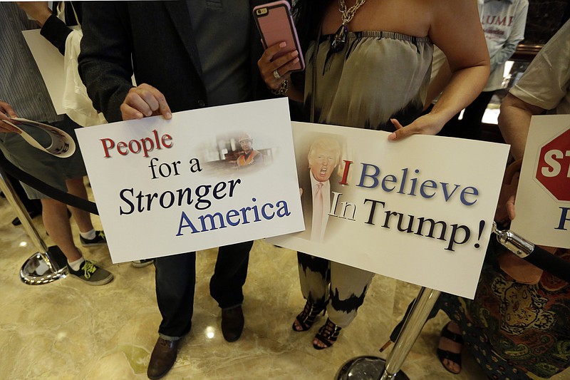 Supporters of developer Donald Trump wait for his announcement that he will seek the Republican nomination for president last Tuesday in the lobby of Trump Tower in New York.