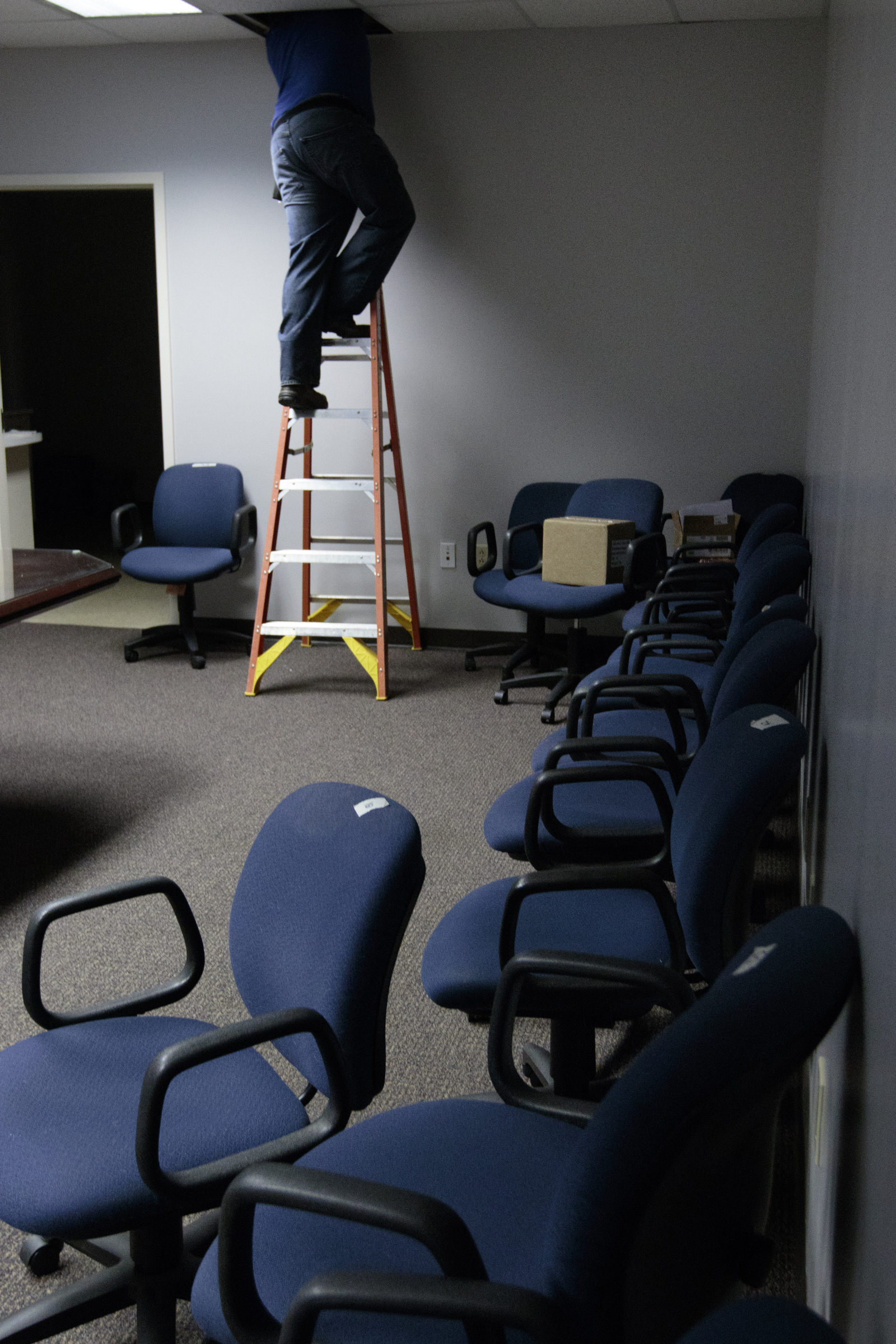 Staff photo by Doug Strickland
Dale Brewster with Gallaher & Associates works to install a security system Wednesday, June 17, 2015, at the Family Justice Center in Chattanooga, Tenn. The center is scheduled to launch July 1st.