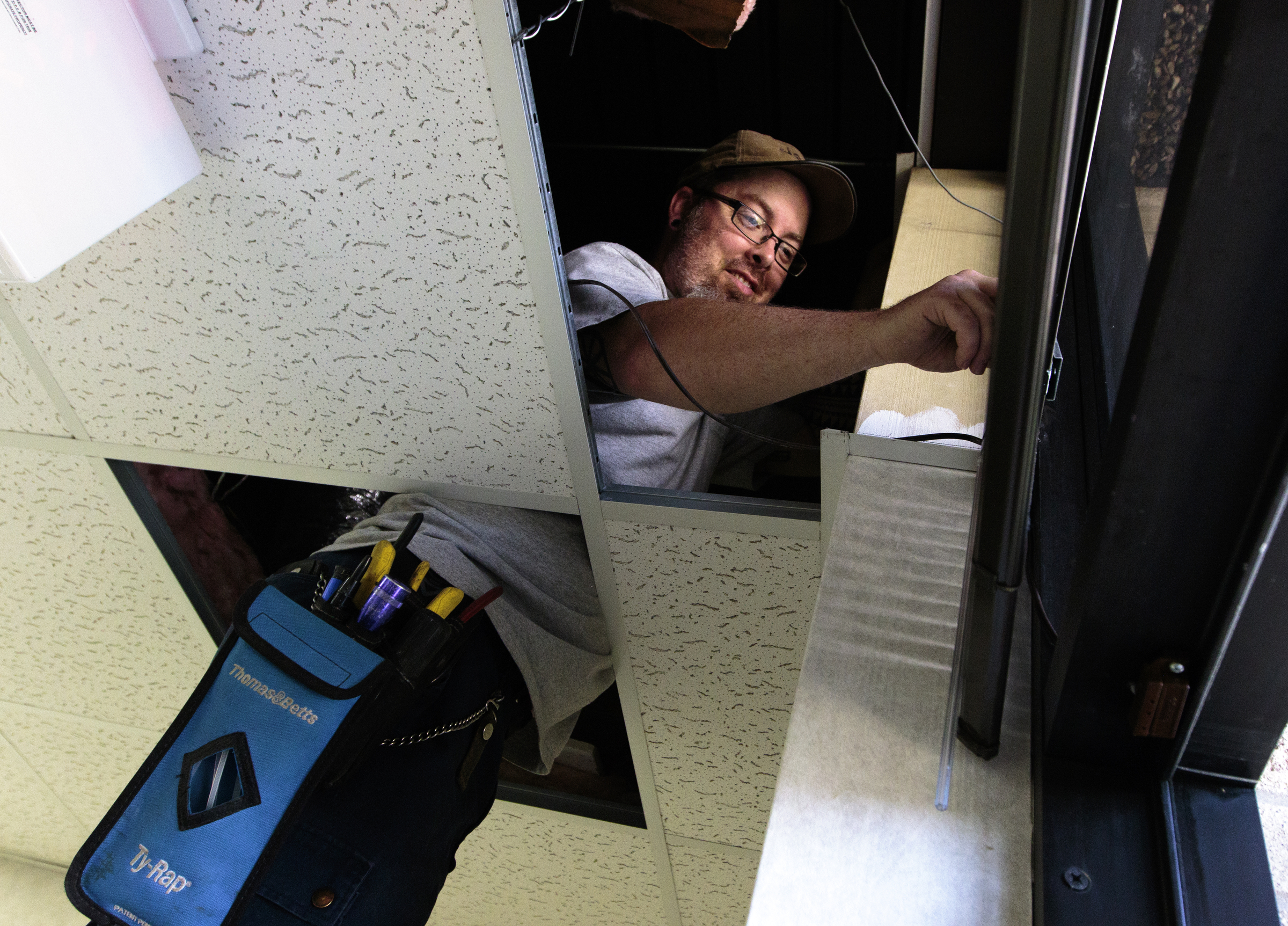 Staff photo by Doug Strickland
Marc Benton with Gallaher & Associates works to install a security system Wednesday, June 17, 2015, at the Family Justice Center in Chattanooga, Tenn. The center is scheduled to launch July 1st.