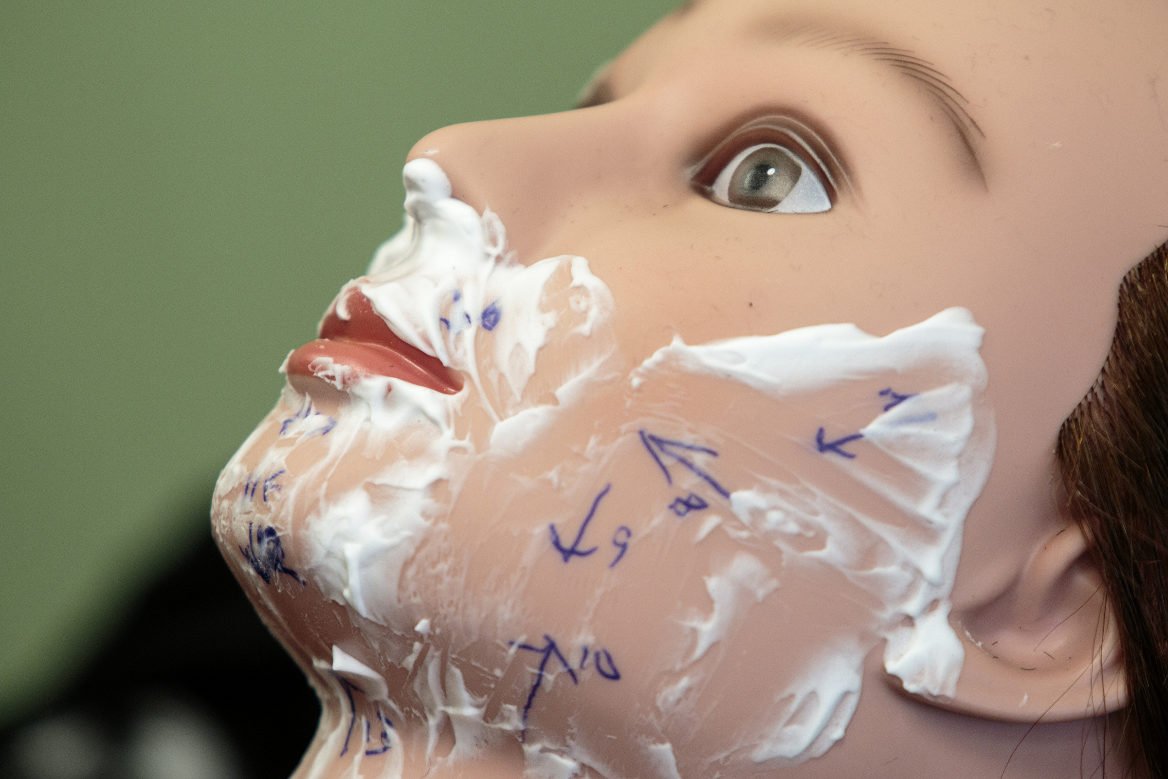 Staff photo by Doug Strickland
Shaving cream coats part of the face of a shaving practice dummy Wednesday, June 17, 2015, at Baker's Barber College in Chattanooga, Tenn. Tim Baker opened the barber college at the beginning of May.