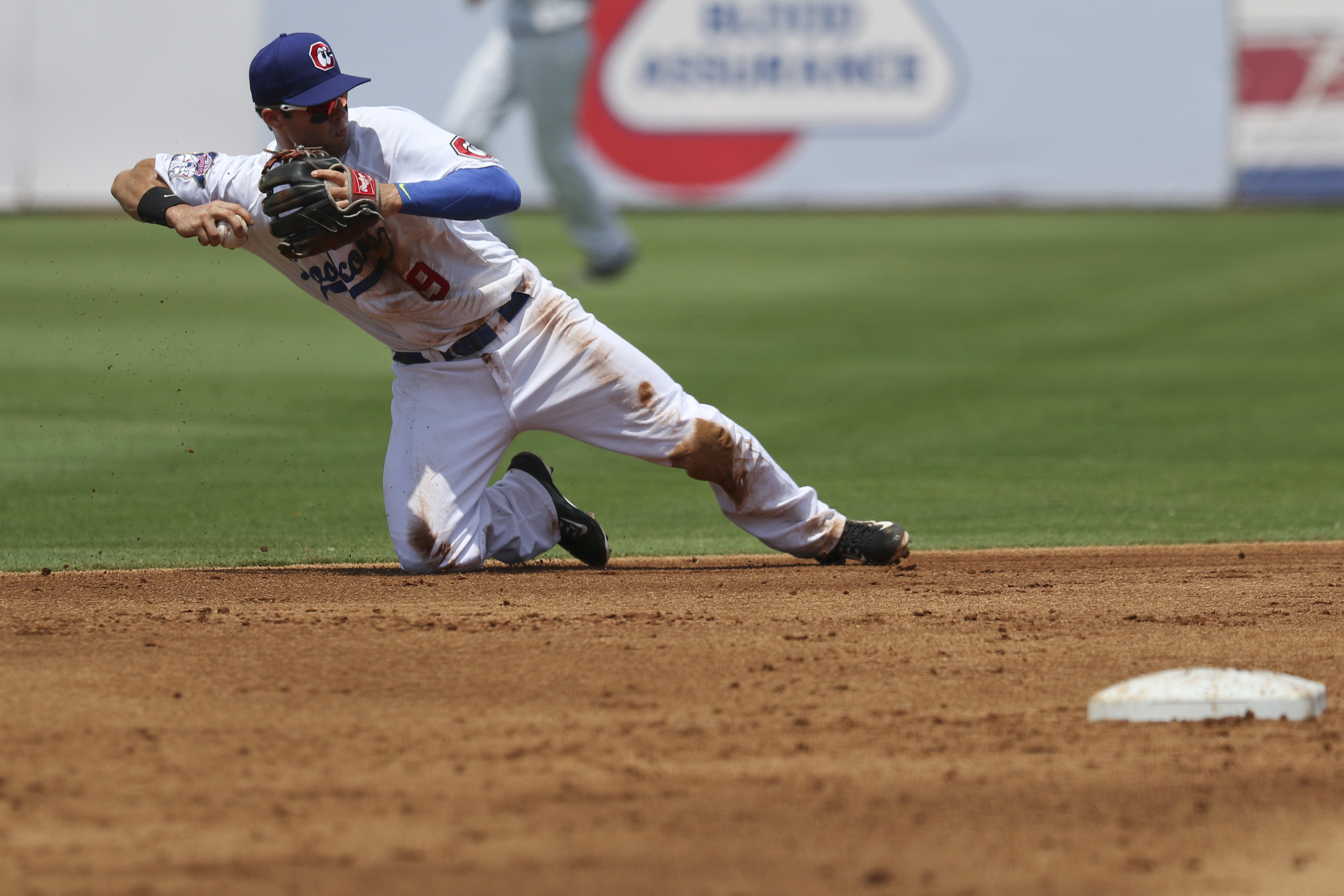 Staff Photo by Dan Henry / The Chattanooga Times Free Press- 6/21/15. Chattanooga Lookouts second baseman Levi Michael (9) dives to make a catch before throwing to first for an out while playing the Jacksonville Suns at AT&T field on Sunday, June 21, 2015.
