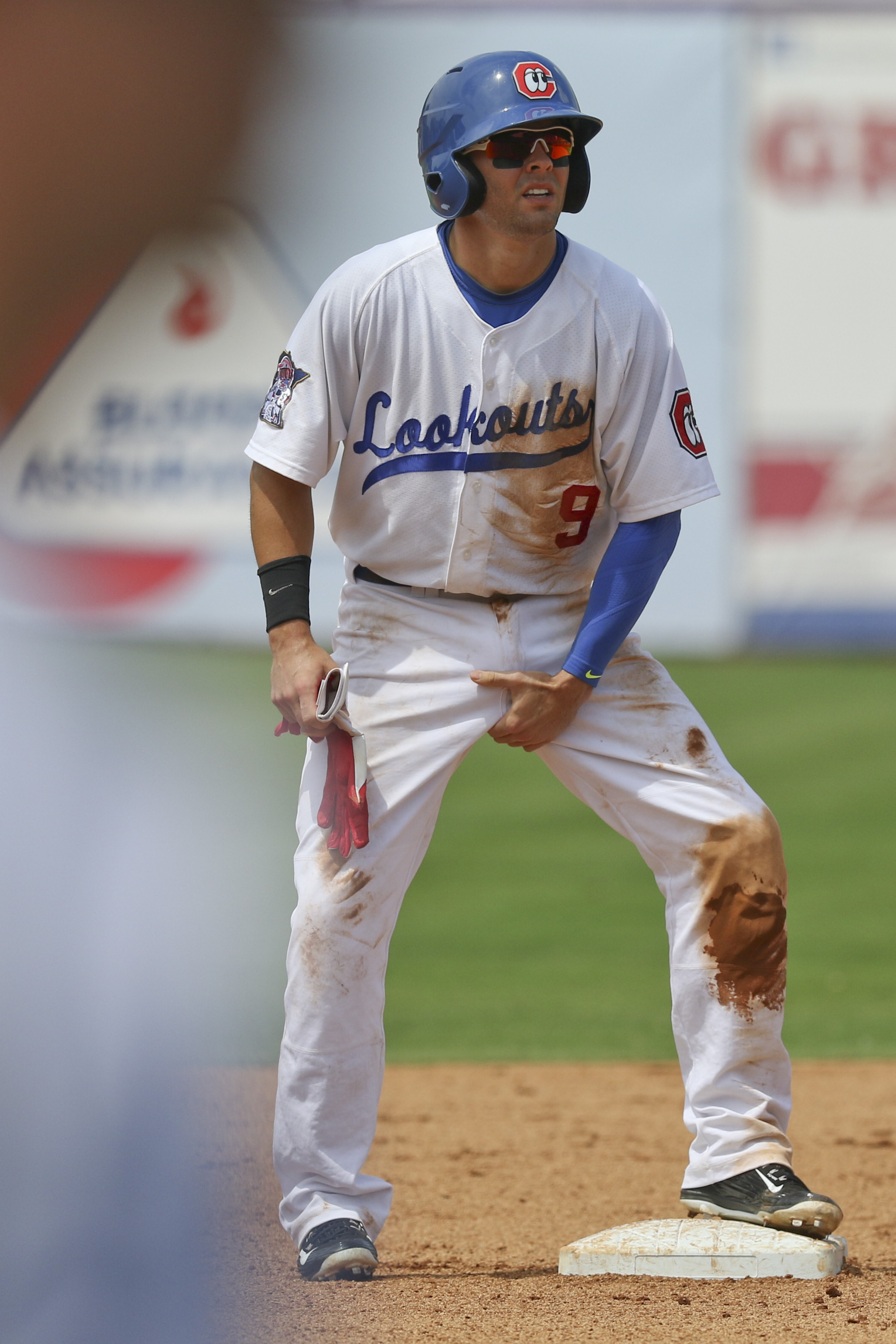 Staff Photo by Dan Henry / The Chattanooga Times Free Press- 6/21/15. Chattanooga Lookouts Levi Michael (9) adjusts himself after stealing second while playing the Jacksonville Suns at AT&T field on Sunday, June 21, 2015.