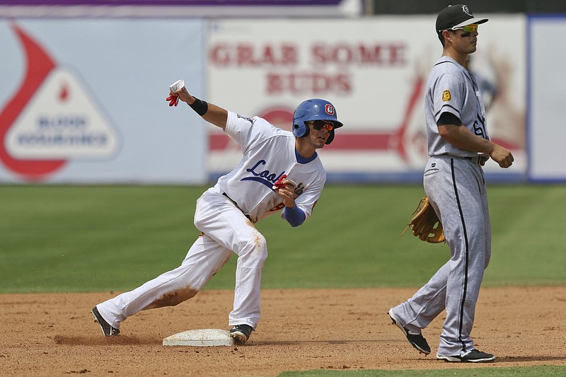 Chattanooga Lookouts Levi Michael (9) steals second as Jacksonville Suns second baseman Terrence Dayleg (16) waits for a throw at AT&T field on Sunday, June 21, 2015. 