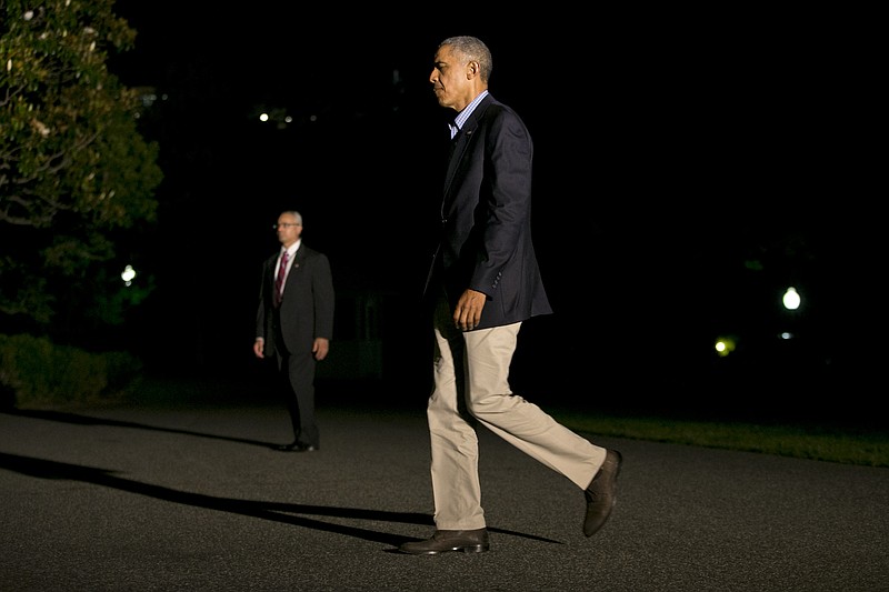 
              President Barack Obama returns to the White House, in Washington, Sunday June 21, 2015, after a weekend in California where spoke at the Annual Meeting of the U.S. Conference of Mayors, attended DNC events, and later played golf. (AP Photo/Jacquelyn Martin)
            