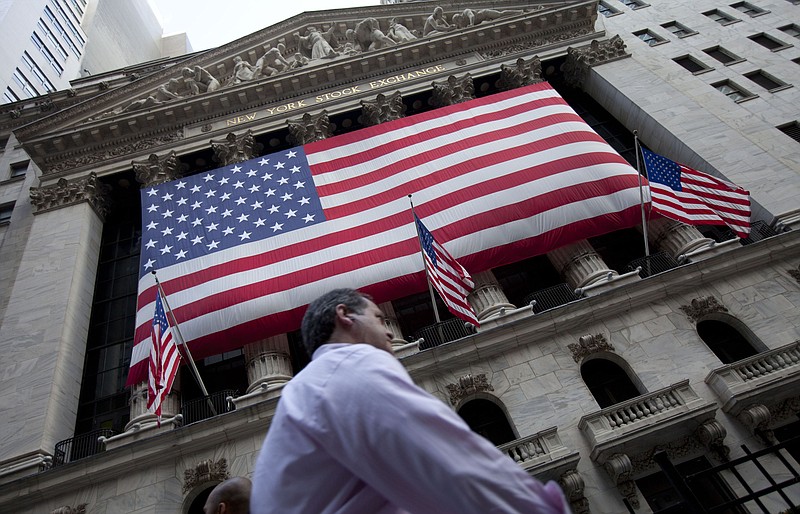 
              FILE - In this Monday, Aug. 8, 2011 file photo, a pedestrian walks past the New York Stock Exchange in New York. U.S. stocks are opening higher Monday, June 22, 2015 on hopes of a breakthrough in Greece's bailout discussions with its creditors even as few tangible signs of progress emerged from meetings in Europe. (AP Photo/Jin Lee, File)
            