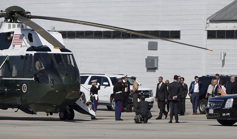 
              President Barack Obama walks to board Marine One Friday, June 19, 2015, at the Santa Monica, Calif, landing zone  en route to tape a podcast interview with comedian Marc Maron in Pasadena, Calif. (AP Photo/Carolyn Kaster)
            