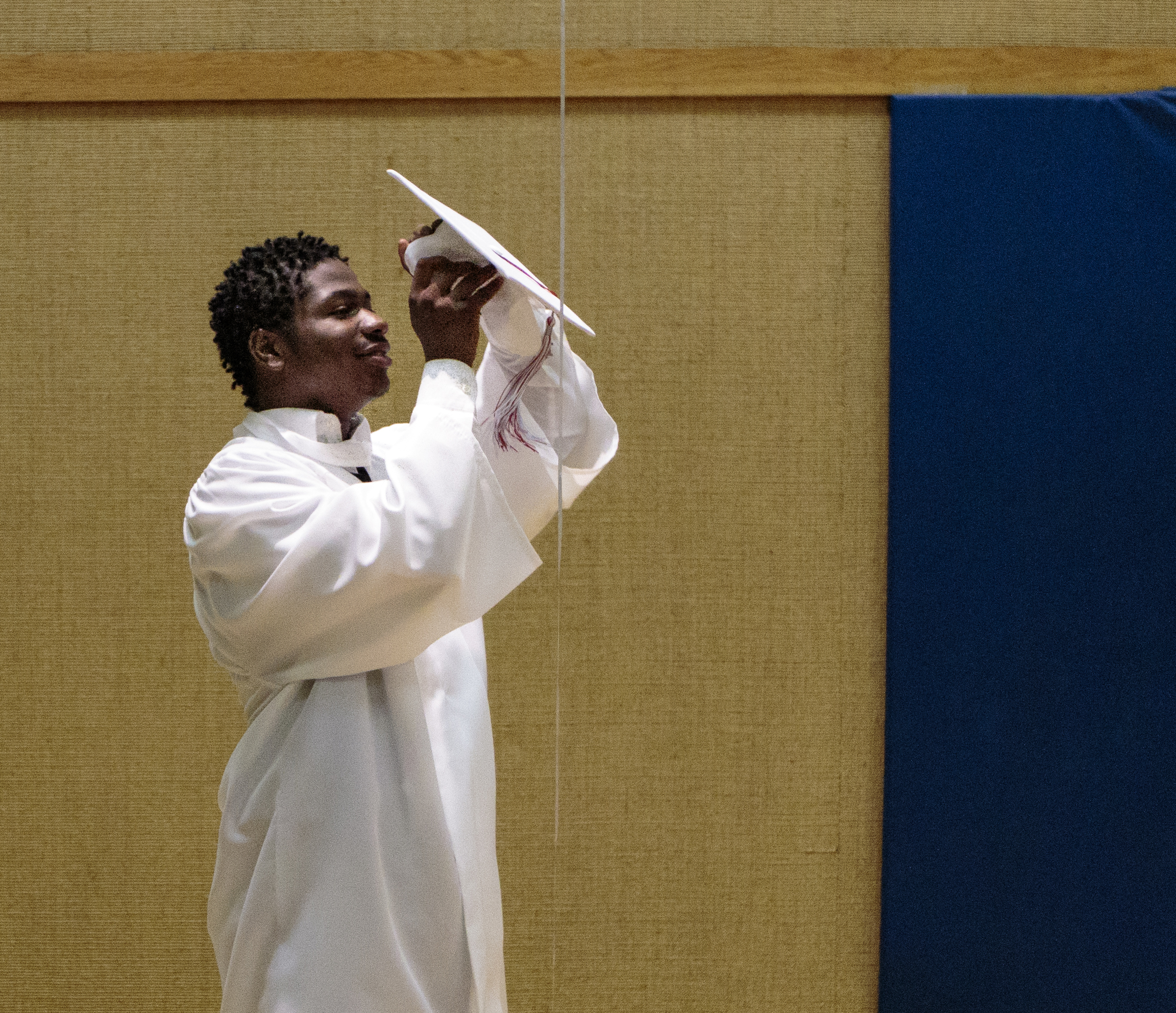 Staff photo by Doug Strickland
Kobeai Ford puts on his graduation cap before Brainerd High School's first-ever summer graduation Tuesday, June 23, 2015, at the North Moore Road Salvation Army, across from the high school, in Chattanooga, Tenn.