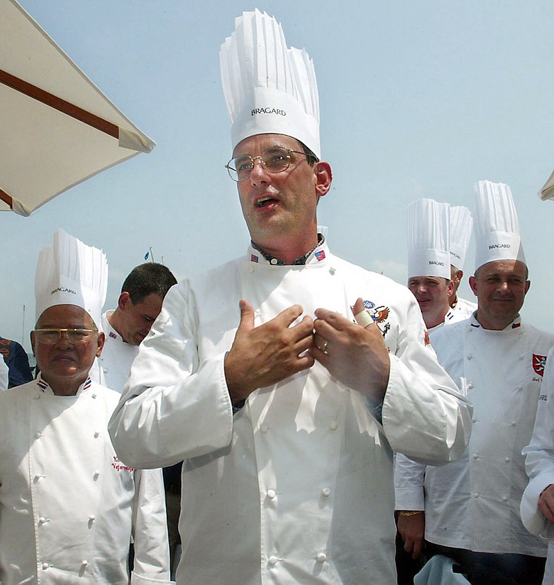 
              FILE - In this July 27, 2004 file photo, outgoing White House chef Walter Scheib greets chefs from around the world at the Chesapeake Bay Maritime Museum in St. Michaels, Md. Searchers found the body of former White House chef Walter Scheib Sunday night, June 21, 2015, near a hiking trail in mountains in the Taos, N.M. area, the New Mexico State Police said. Scheib had been missing for more than a week after going hiking in the New Mexico mountains, authorities said. (AP Photo/Matt Houston, File)
            