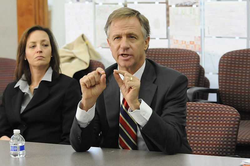 Staff file photoAlexia Poe, director of communications for the State of Tennessee, listens as Tennessee Gov. Bill Haslam during a 2014 meeting.