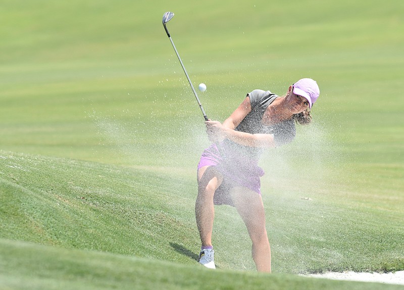 Allyson Dunn of Kingsport hits a sand shot out of the greenside bunker at No. 8 during semifinal play Thursday in the Tennessee Women's Amateur tournament at Chattanooga Golf and Country Club. She plays today for the championship.