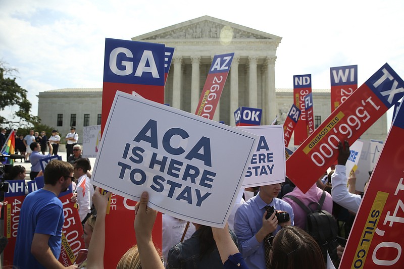 A crowd reacts after the U.S. Supreme Court on Thursday ruled that President Obama's health care law may provide nationwide tax subsidies to help poor and middle-class Americans buy health insurance. (Doug Mills/The New York Times)