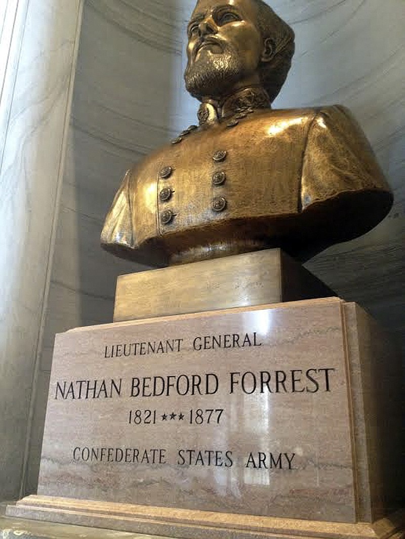 In this Wednesday, June 24, 2015 photo, a bust of Nathan Bedford Forrest, a Confederate general and early leader of the Ku Klux Klan, sits inside the Capitol in Nashville, Tenn. Gov. Bill Haslam said Tuesday that he supports removing the bust as well as Confederate flags from state license plates. (Dave Boucher/The Tennessean via AP)