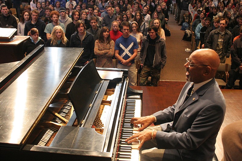File photoRoland M. Carter performs for students in this file photo. His arrangement of the spiritual "In Bright Mansions Above" was chosen to be used during the today's funeral services for the Rev. Clementa Pinckney in Charleston, S.C.