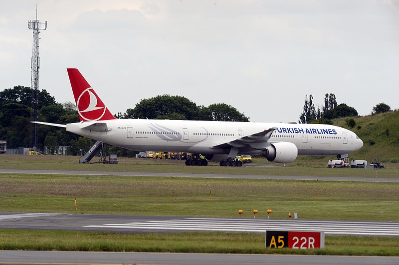 
              A Turkish Airlines plane is seen in Copenhagen Airport, Denmark, Thursday, June 25, 2015 . Danish police says a New York-bound Turkish Airlines plane made an emergency landing at Copenhagen's international airport after an old camera bag, possibly forgotten by a passenger, caused a bomb scare. (Kenneth Meyer/Polfoto via AP) DENMARK OUT
            