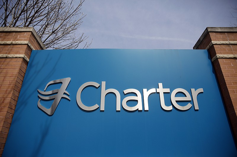 
              This April 1, 2015 photo shows signage at an entrance to Charter Communications' headquarters in Town and Country, Mo. Charter is trying to convince the government that consumers will benefit if it is allowed to create a cable giant through its proposed $67.1 billion acquisition of Time Warner Cable and Bright House. (AP Photo/Jeff Roberson)
            