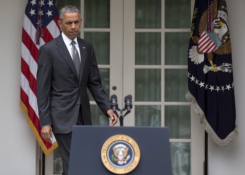 
              President Barack Obama arrives in the Rose Garden of the White House in Washington, Thursday, June 25, 2015, to speak after the Supreme Court upheld the subsidies for customers in states that do not operate their own exchanges under President Barack Obama's Affordable Care Act. (AP Photo/Carolyn Kaster)
            