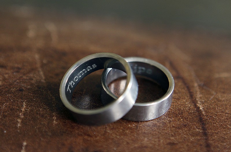 
              In this photo taken March 22, 2015, the rings of Thomas Kostura and Ijpe DeKoe sit on a table in their Memphis, Tenn. apartment. According to an Associated Press-GfK poll in April, nearly half of Americans favor laws allowing gay and lesbian couples to wed in their own states, while just over a third are opposed. The poll was conducted just before the Supreme Court heard oral arguments in a case that will probably decide whether states can continue to bar same-sex couples from marrying. Kostura and deKoe were married in New York in 2011.  (AP Photo/Karen Pulfer Focht)
            