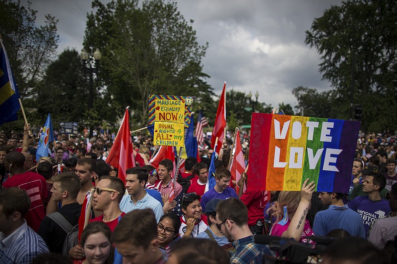 Gay rights supporters celebrate outside of U.S. Supreme Court following Friday's announcement of the ruling on the same-sex marriage case.