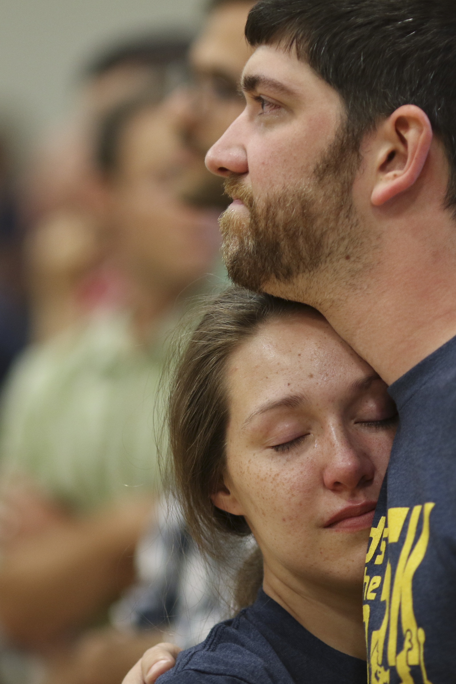 Photo by Dan Henry / The Chattanooga Times Free Press. Tanner Hunt and Maria Shepherd embrace during a candlelight vigil on Friday June 26, 2015 for Ocoee Middle School's band director, Brian Gallaher, who was one of the six people killed in a crash on I-75 late Thursday evening.