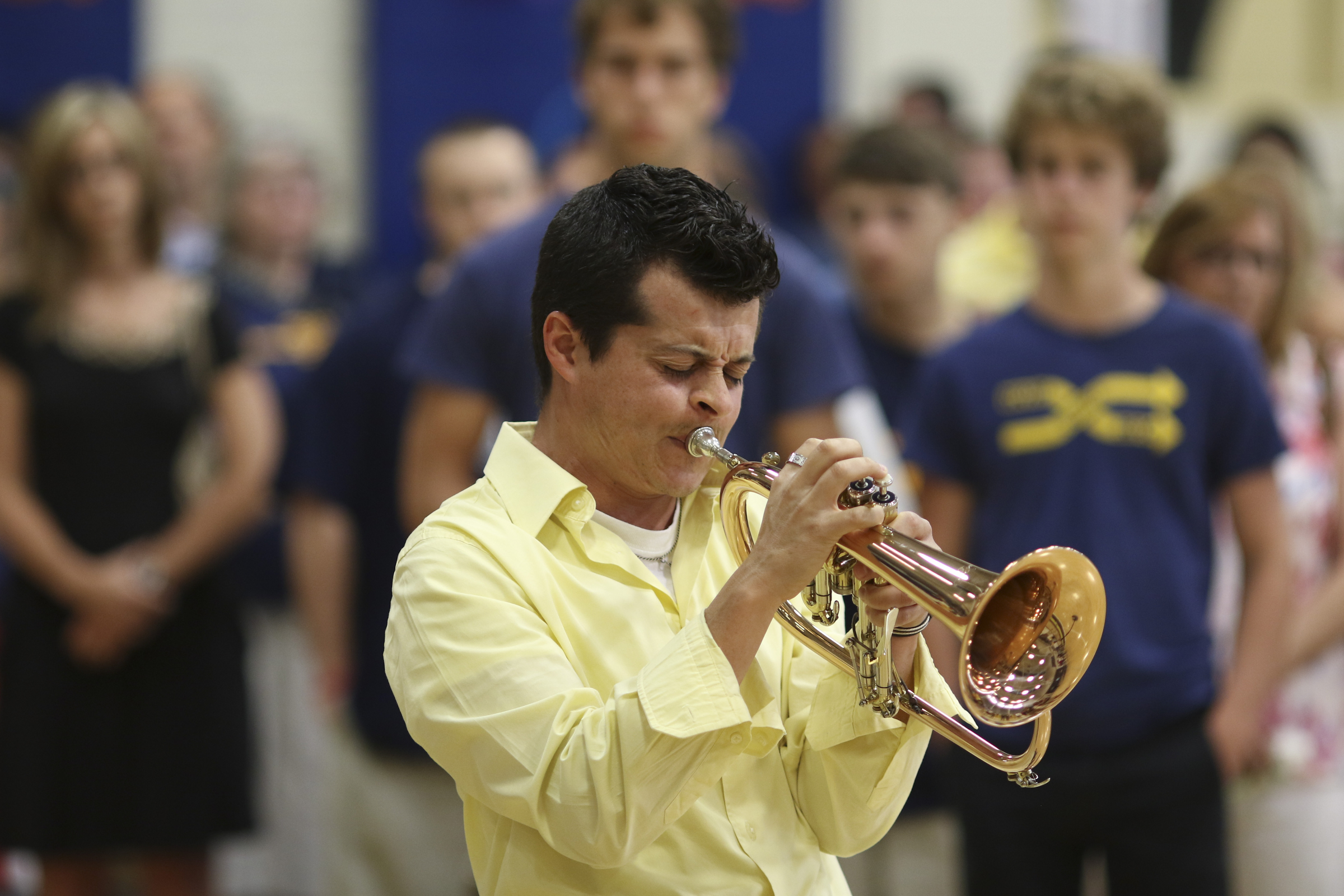 Photo by Dan Henry / The Chattanooga Times Free Press. Rival school band director Caleb Bolanos from Cleveland Middle School plays amazing grace on the flugelhorn during a candlelight vigil on Friday June 26, 2015 for Ocoee Middle School's band director, Brian Gallaher, who was one of the six people killed in a crash on I-75 late Thursday evening.