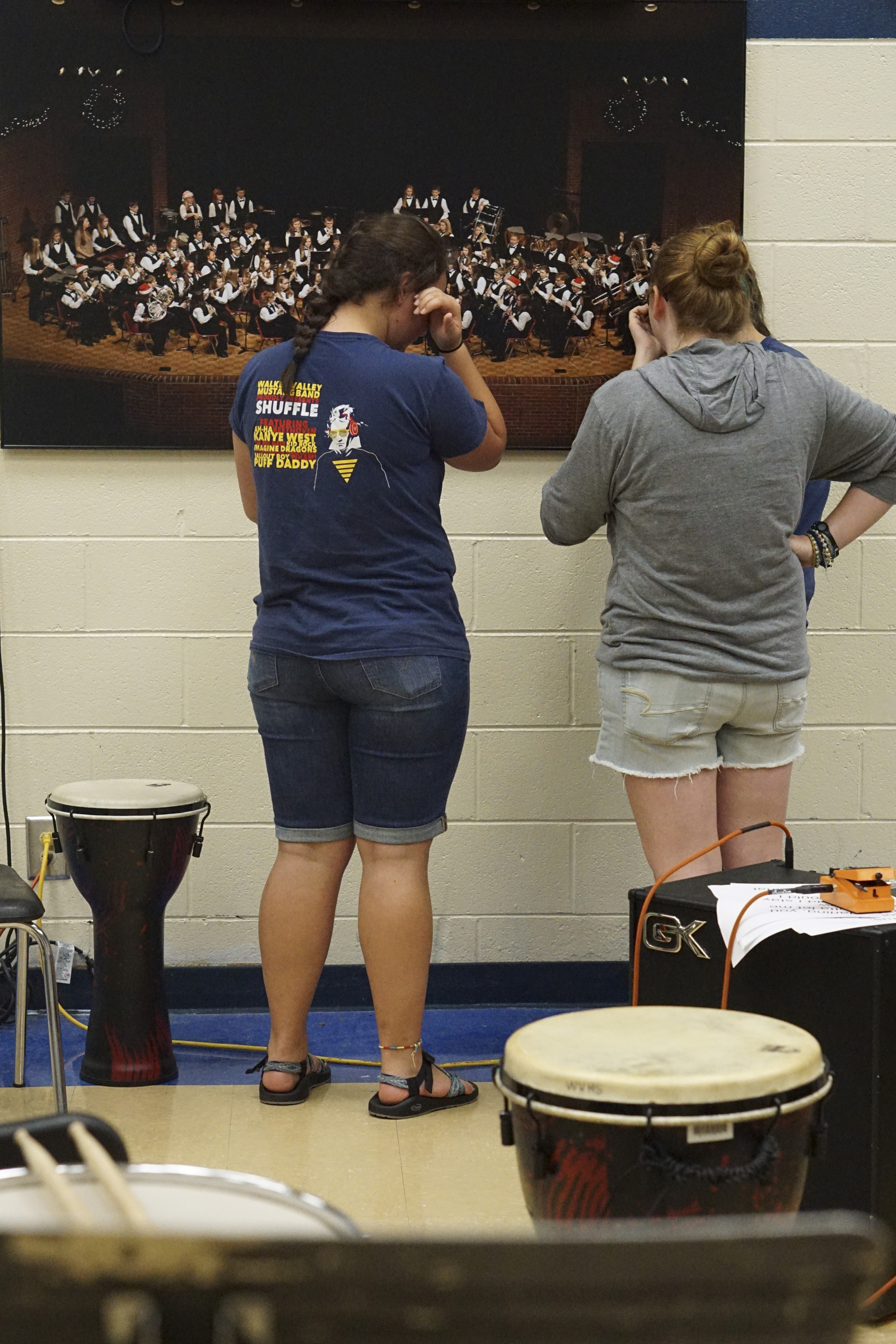 Photo by Dan Henry / The Chattanooga Times Free Press. Ella Colbert, Selena Overly, and Sydney Cline, from left, become emotional while looking at a photo from their band performance during a candlelight vigil on Friday June 26, 2015 for Ocoee Middle School's band director, Brian Gallaher, who was one of the six people killed in a crash on I-75 late Thursday evening.