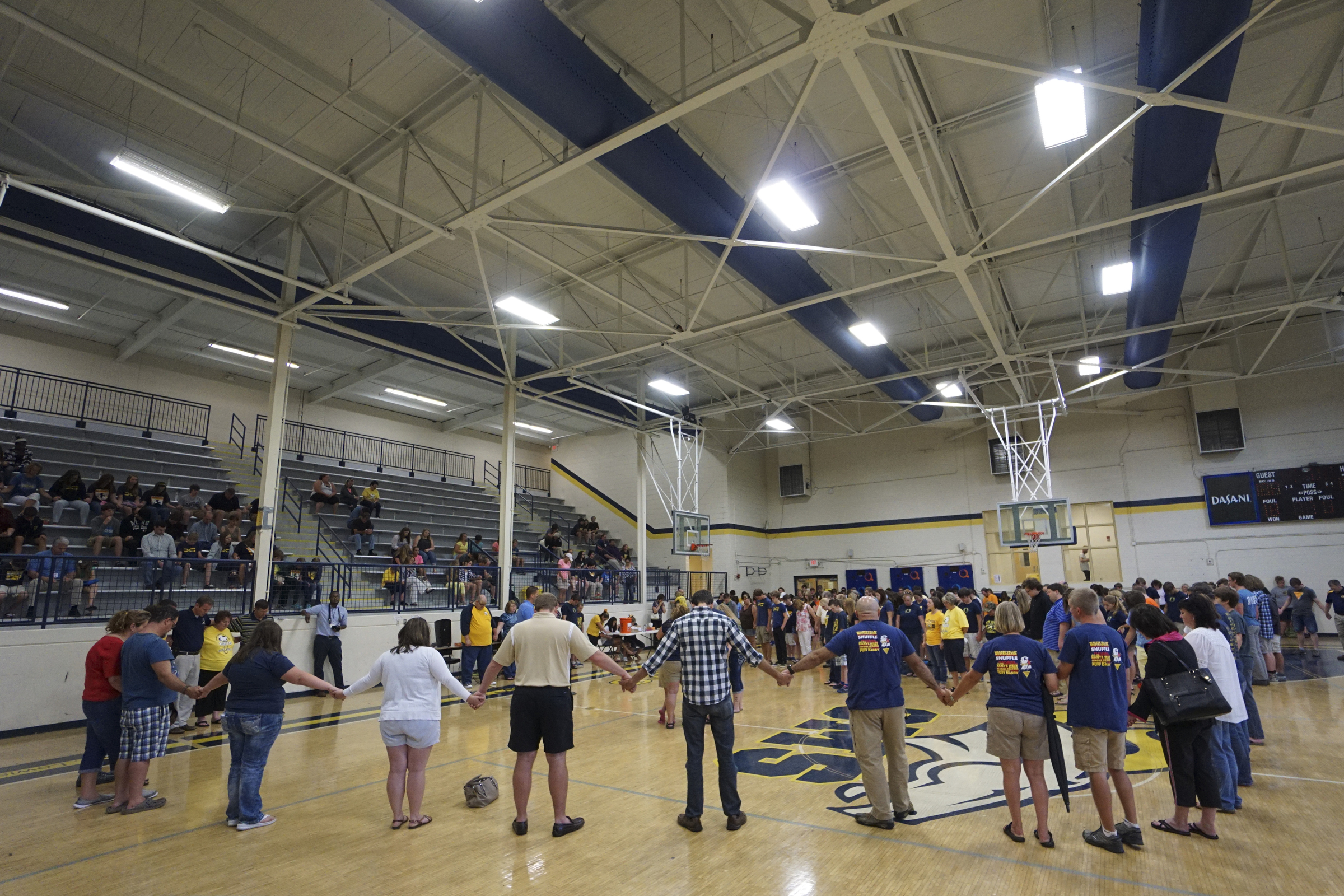 Photo by Dan Henry / The Chattanooga Times Free Press. Students, friends and family pray during a candlelight vigil on Friday June 26, 2015 for Ocoee Middle School's band director, Brian Gallaher, who was one of the six people killed in a crash on I-75 late Thursday evening.