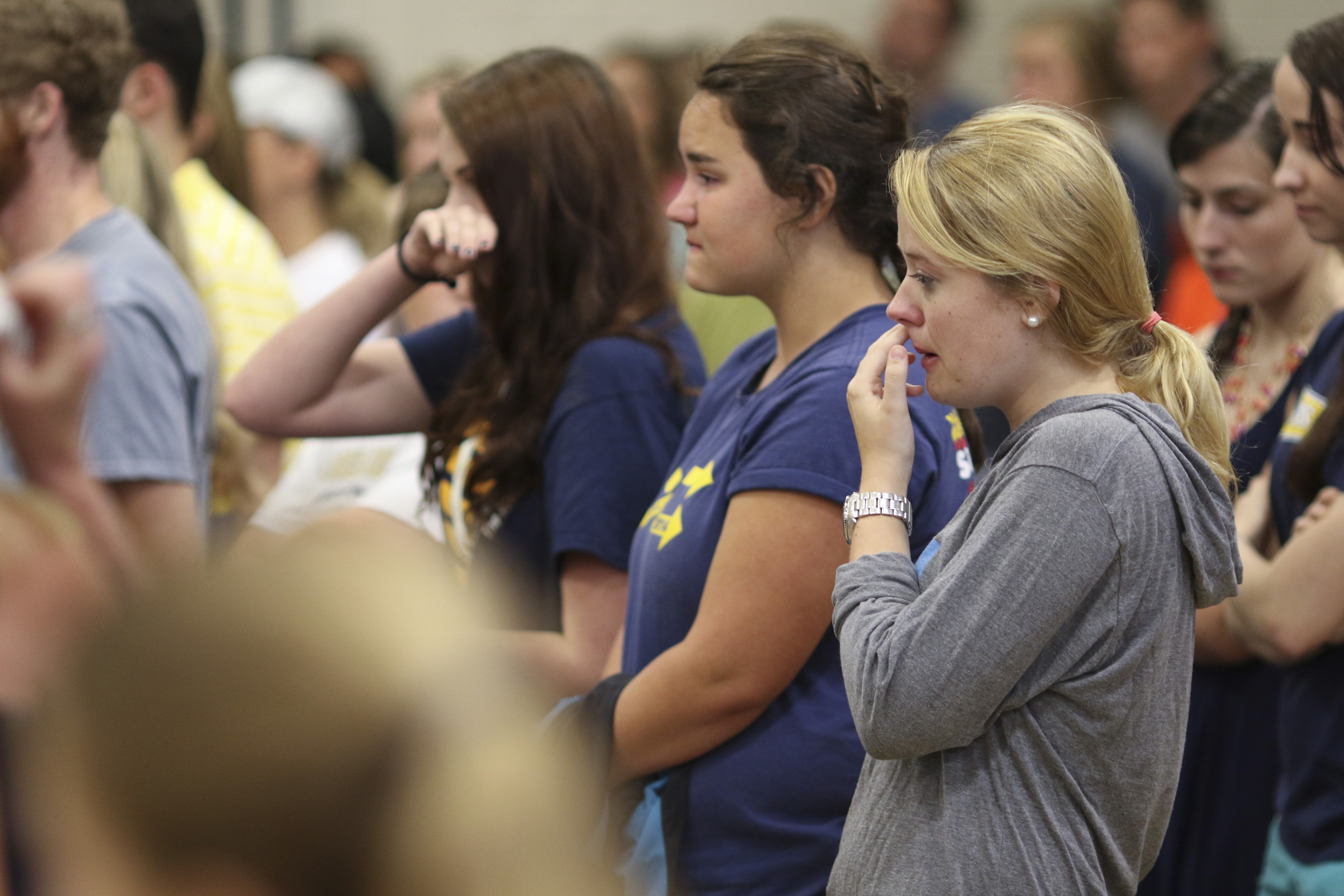 Photo by Dan Henry / The Chattanooga Times Free Press. Mallory Wickam, right, and other students, friends and family become emotional during a candlelight vigil on Friday June 26, 2015 for Ocoee Middle School's band director, Brian Gallaher, who was one of the six people killed in a crash on I-75 late Thursday evening.
