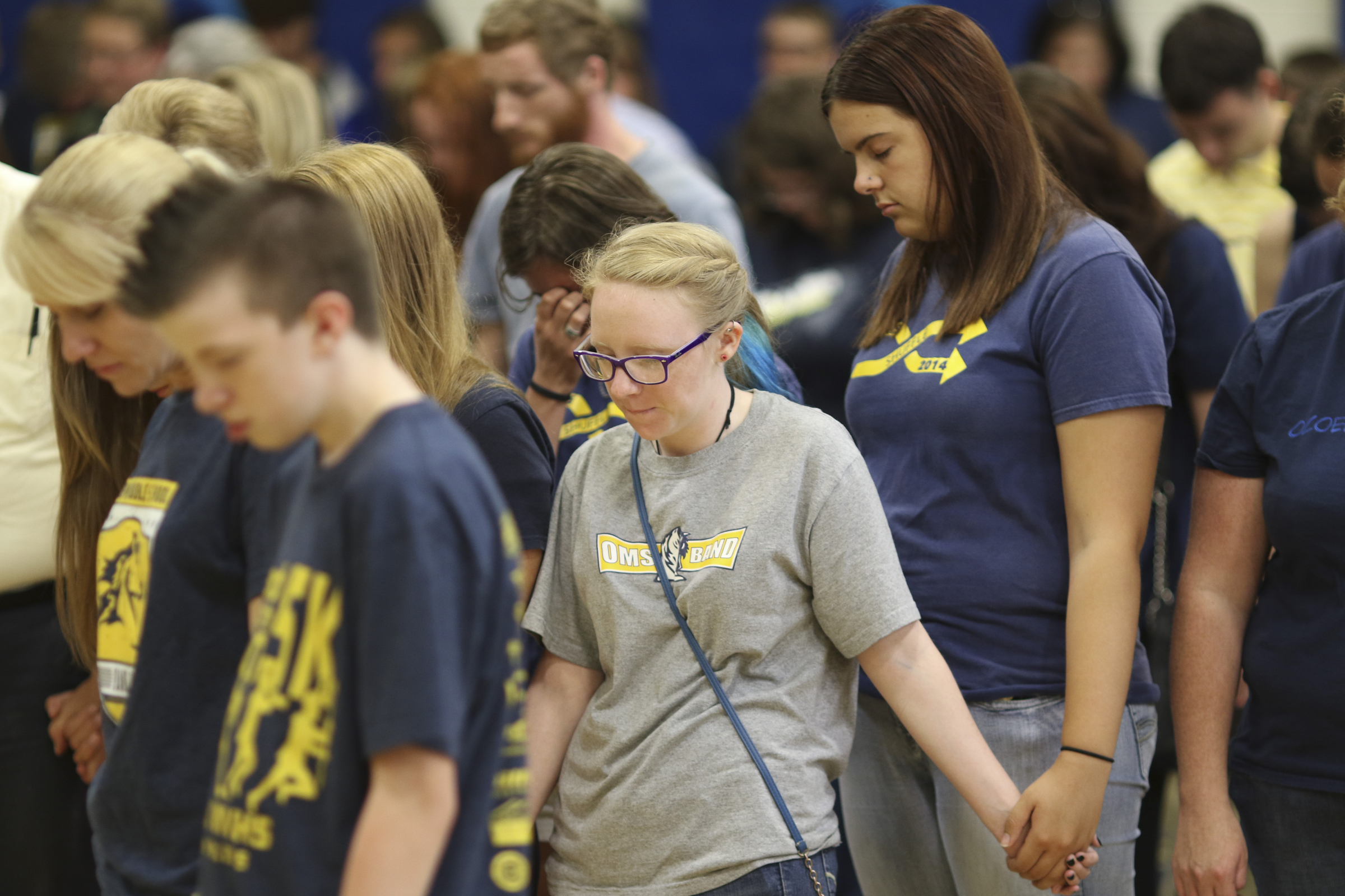 Photo by Dan Henry / The Chattanooga Times Free Press. Students, friends and family pray during a candlelight vigil on Friday June 26, 2015 for Ocoee Middle School's band director, Brian Gallaher, who was one of the six people killed in a crash on I-75 late Thursday evening.