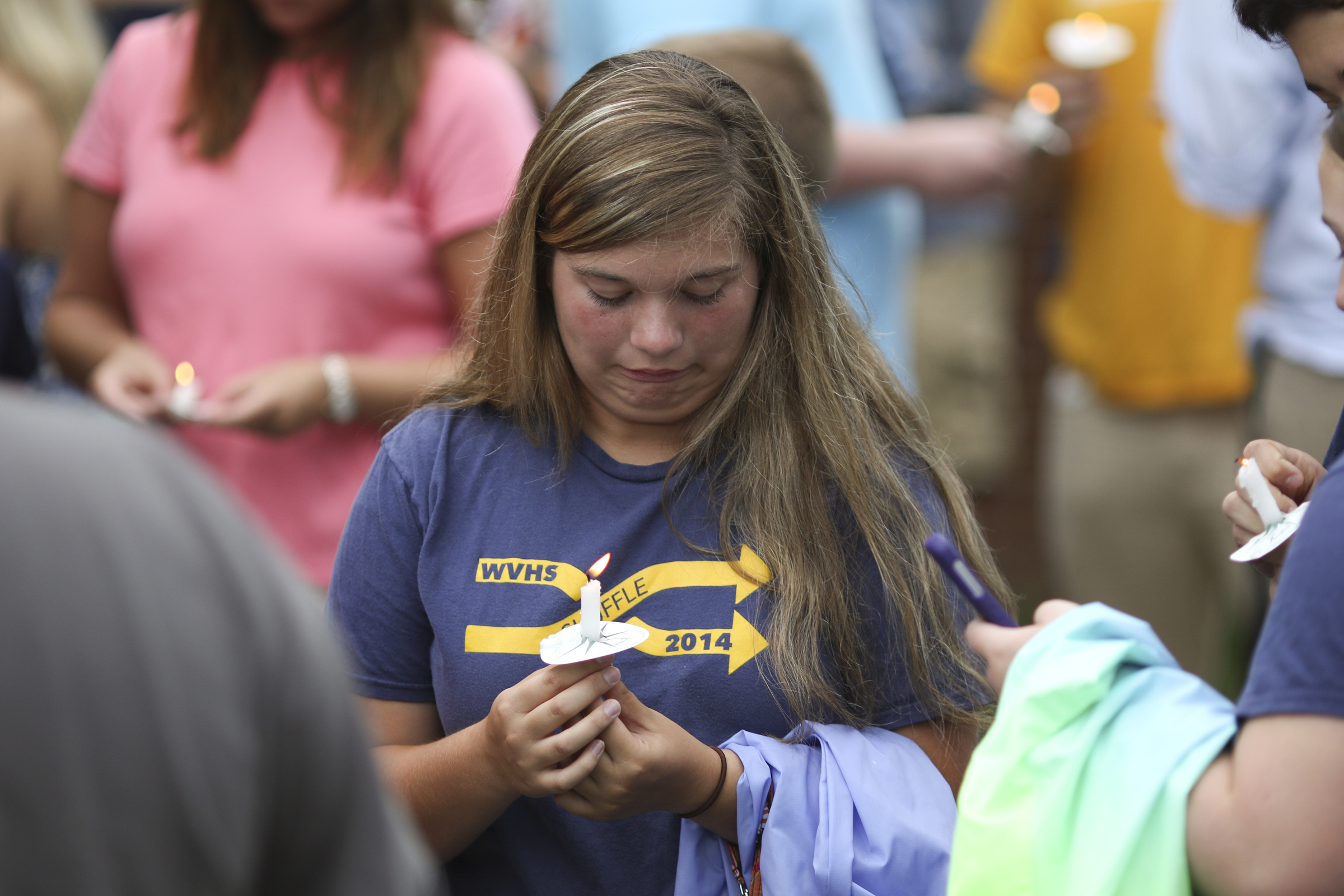 Photo by Dan Henry / The Chattanooga Times Free Press. Marina Coleman stands with other students, friends and family during a candlelight vigil on Friday June 26, 2015 for Ocoee Middle School's band director, Brian Gallaher, who was one of the six people killed in a crash on I-75 late Thursday evening.