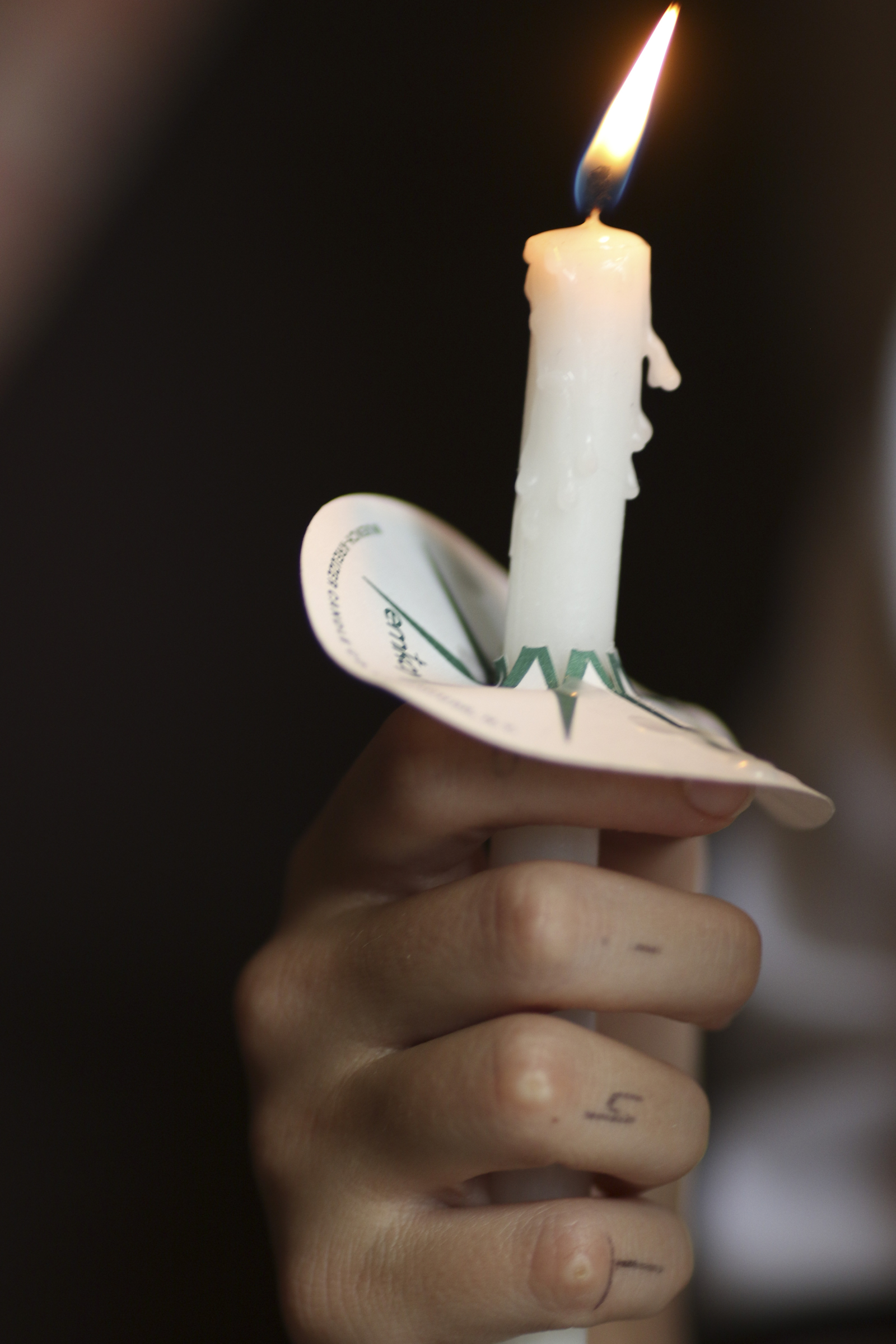 Photo by Dan Henry / The Chattanooga Times Free Press. Arianna Heil hands out candles during a vigil on Friday June 26, 2015 for Ocoee Middle School's band director, Brian Gallaher, who was one of the six people killed in a crash on I-75 late Thursday evening.